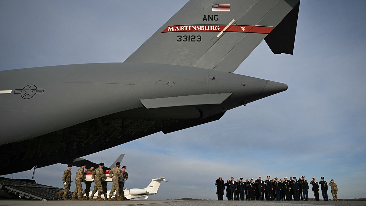 US President Donald Trump and US Secretary of Defense Pete Hegseth salute