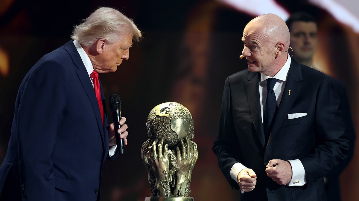 Gianni Infantino presents FIFA Peace Prize to U.S. President Donald Trump at official draw event.