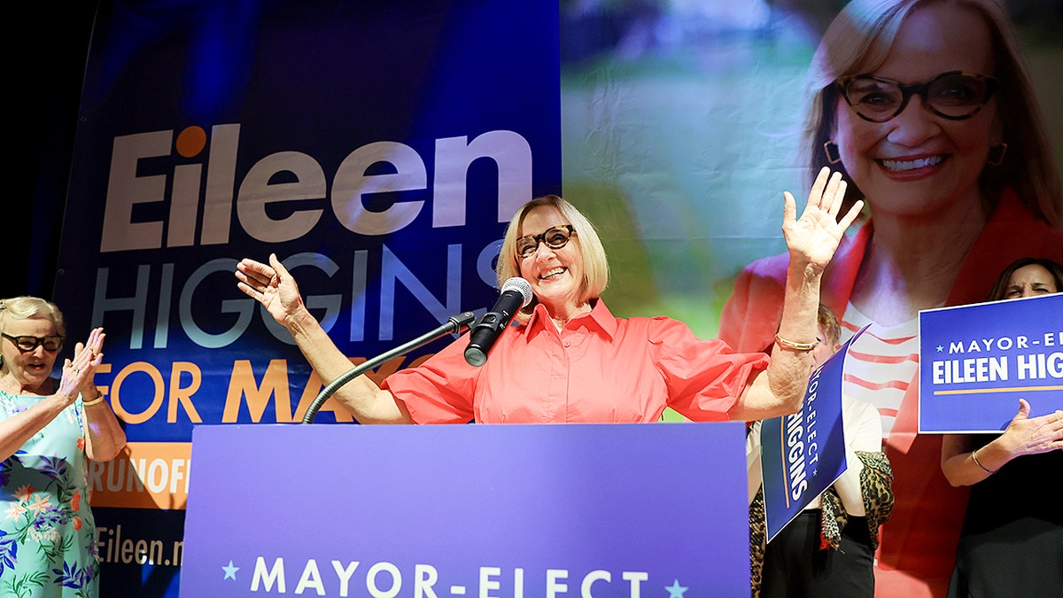Eileen Higgins celebrating with her hands raised