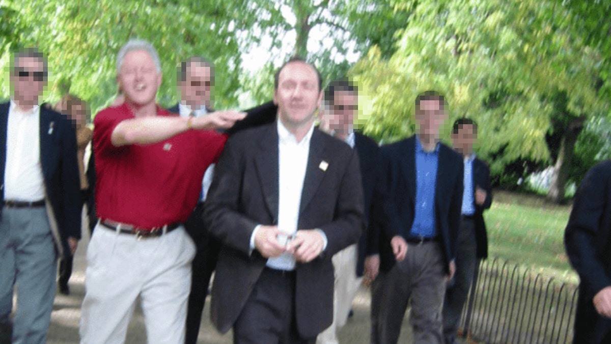 Bill Clinton and Kevin Spacey in a photo in the newly released Epstein files on Friday, Dec. 19. Inclusion in the files does not necessarily imply wrongdoing.