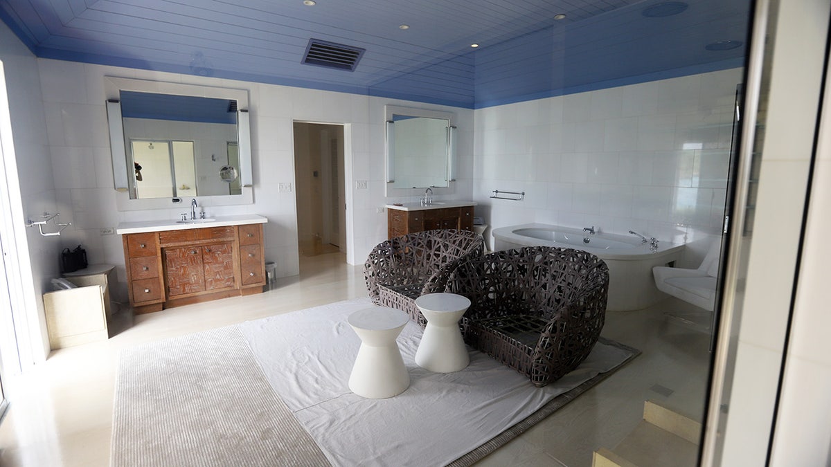 Room with chairs and bathtub on Epstein Island