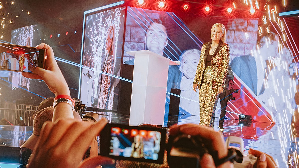 Erika Kirk speaks onstage during a Turning Point USA conference following the death of her husband Charlie Kirk.