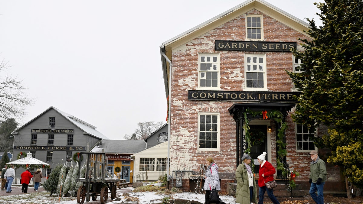 Tourists Christmas Tour at Heirloom Market at Comstock Ferre.