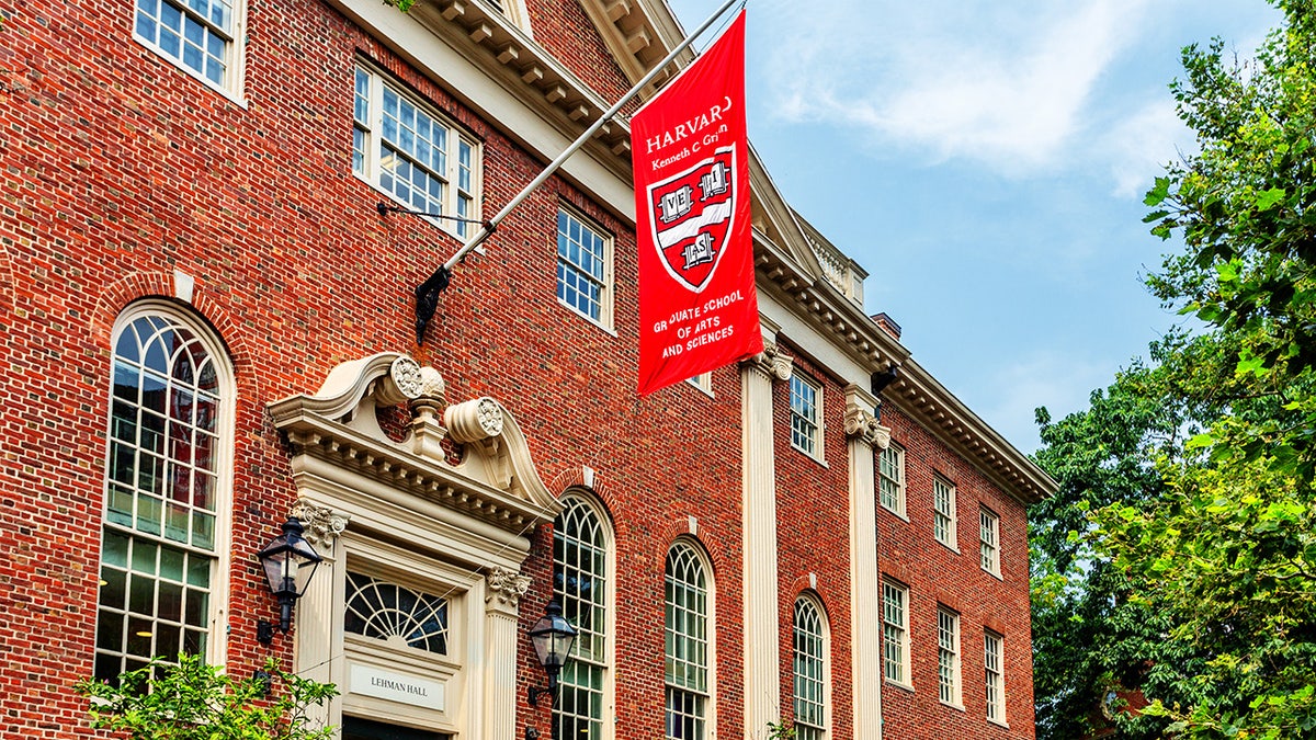 Lehman Hall, a Georgian-revival building in Harvard Yard, stands prominently on a sunny day in Cambridge, Massachusetts.