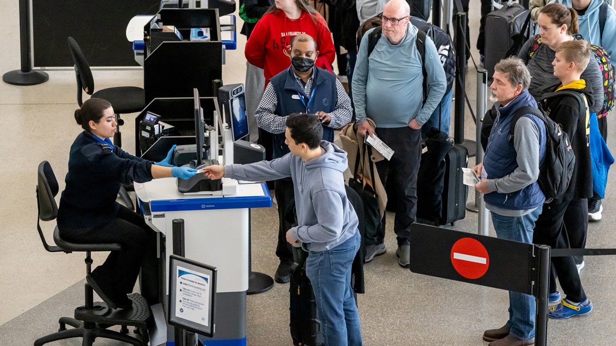 flight passengers at tsa checkpoint at san francisco airport