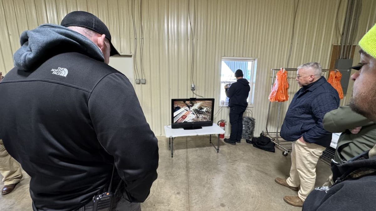 Hopkinsville Fire and EMS members watching aerial footage during a response briefing.