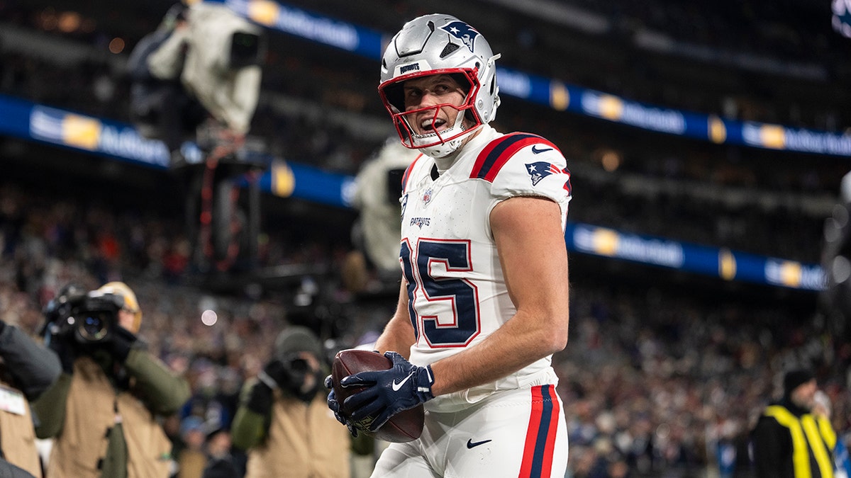 Hunter Henry celebrating a touchdown during an NFL game at M&T Bank Stadium