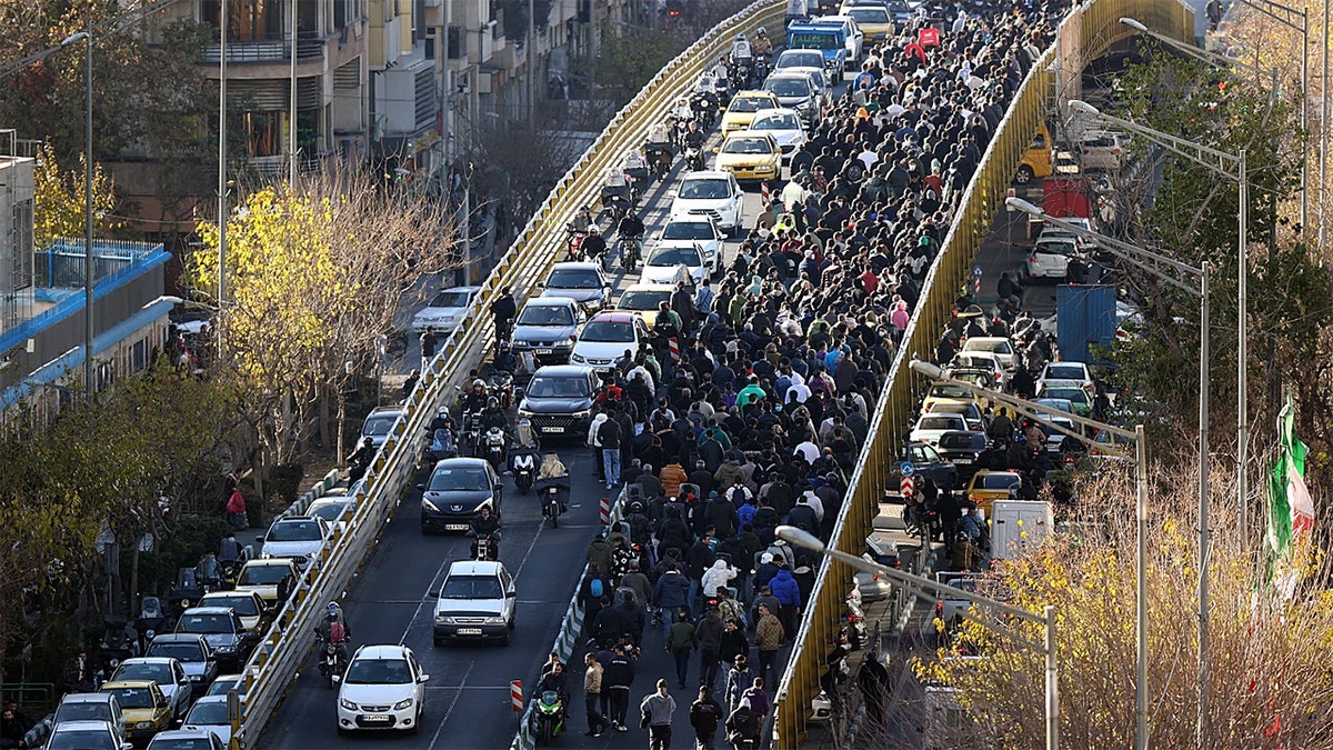 Protesters marching in Iran.