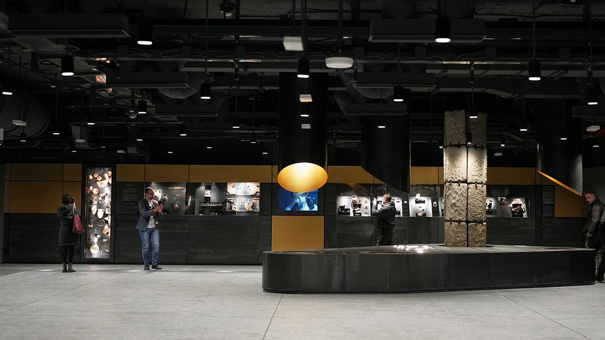 Wide shot of museum display in subway station.