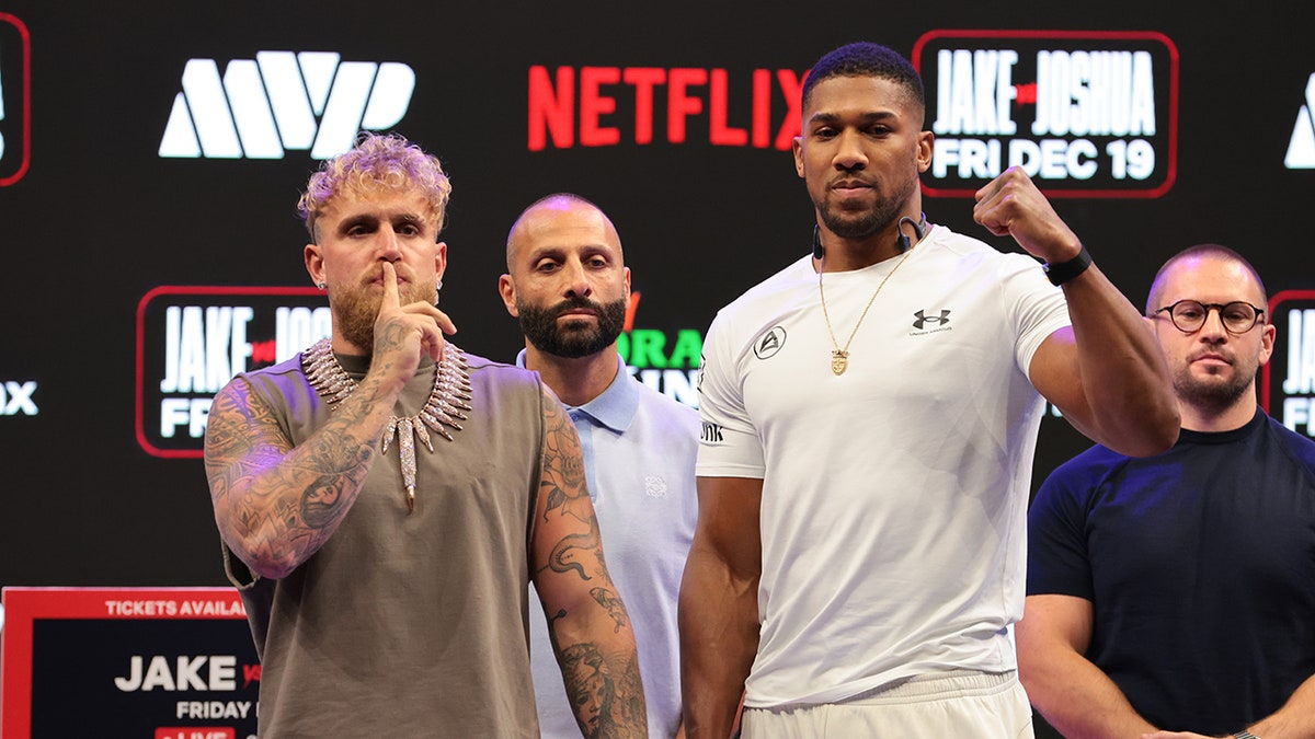 Jake Paul and Anthony Joshua at weigh in