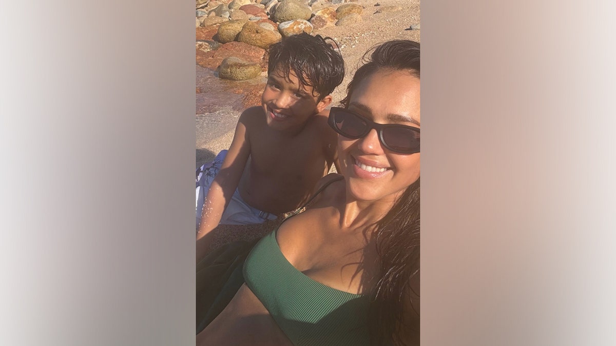 Jessica Alba poses for a beach selfie with her son.