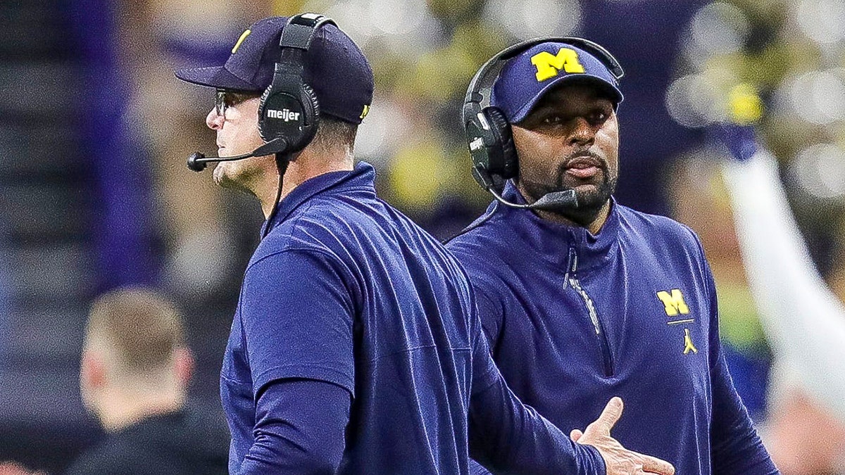 Jim Harbaugh and Sherrone Moore on sideline