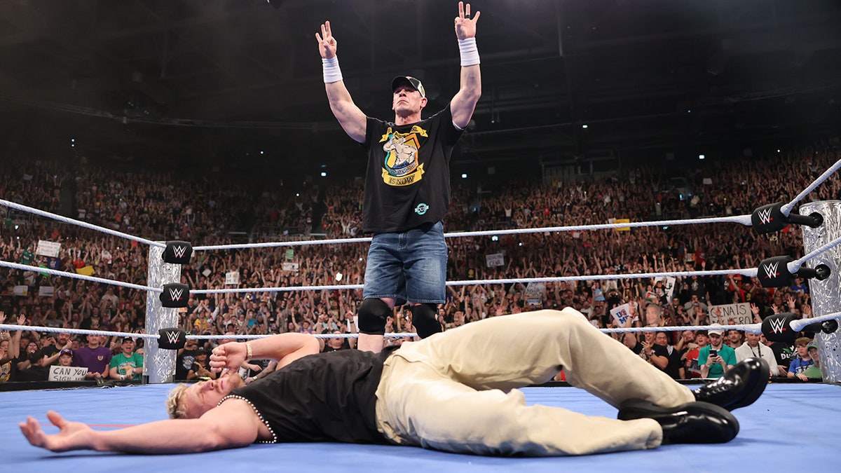 John Cena in ring with Logan Paul