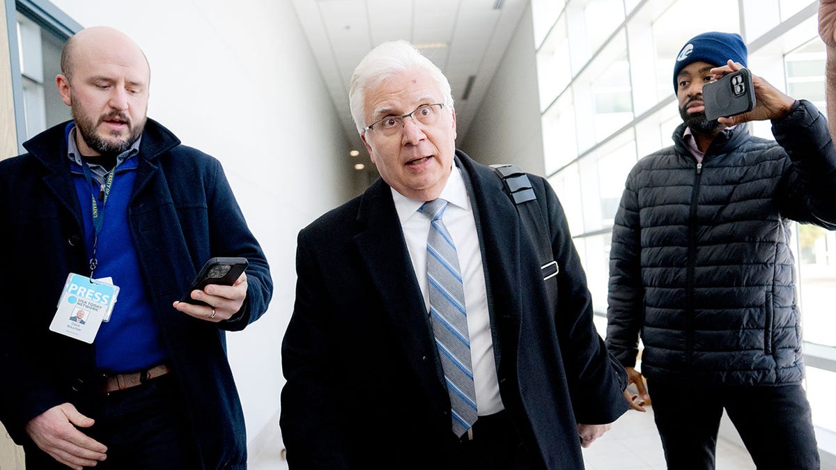 Joseph A. Simon speaks to the media