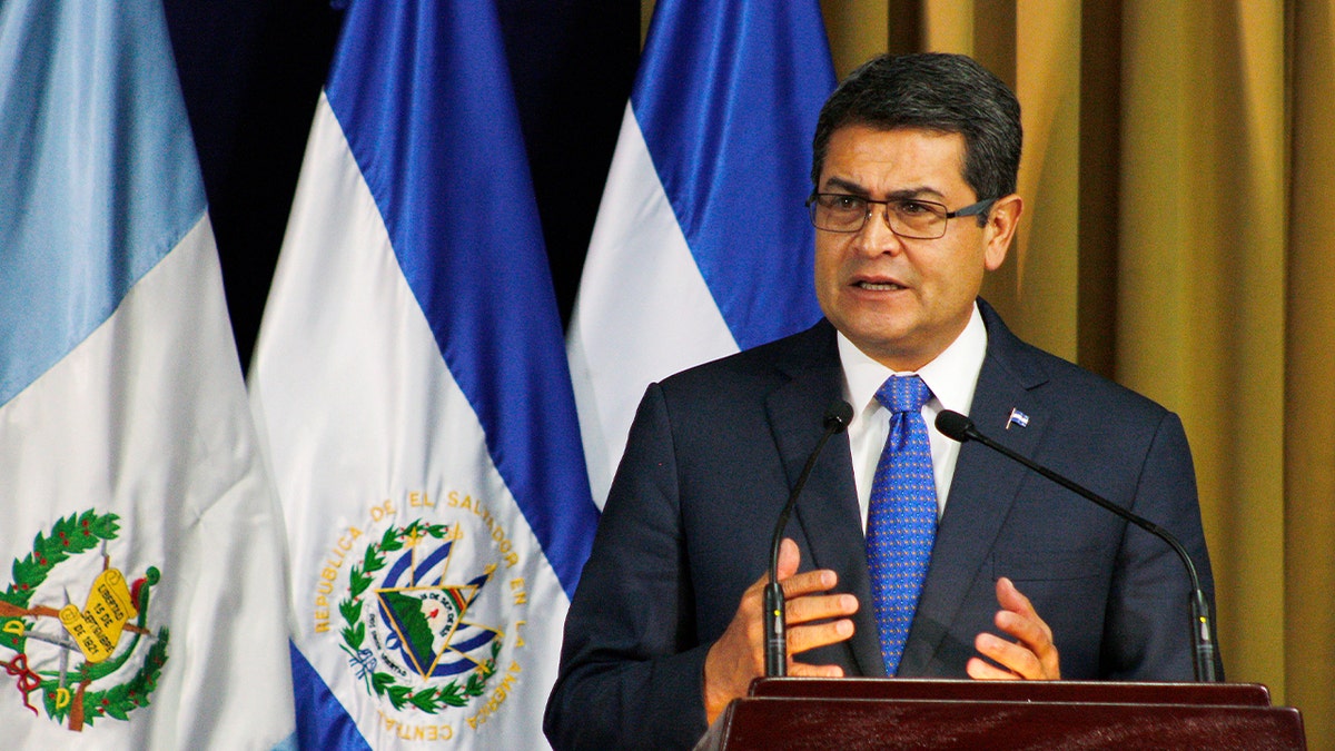 The Honduran president addresses regional leaders during a meeting in El Salvador.