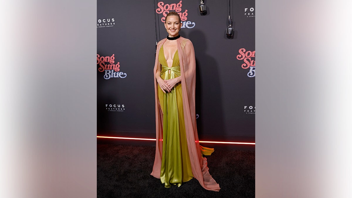 Kate Hudson in a green and pink gown