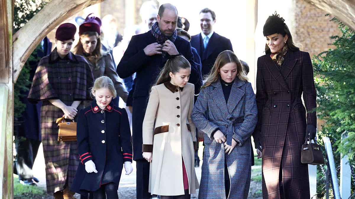 The Wales family walking together outside of church.