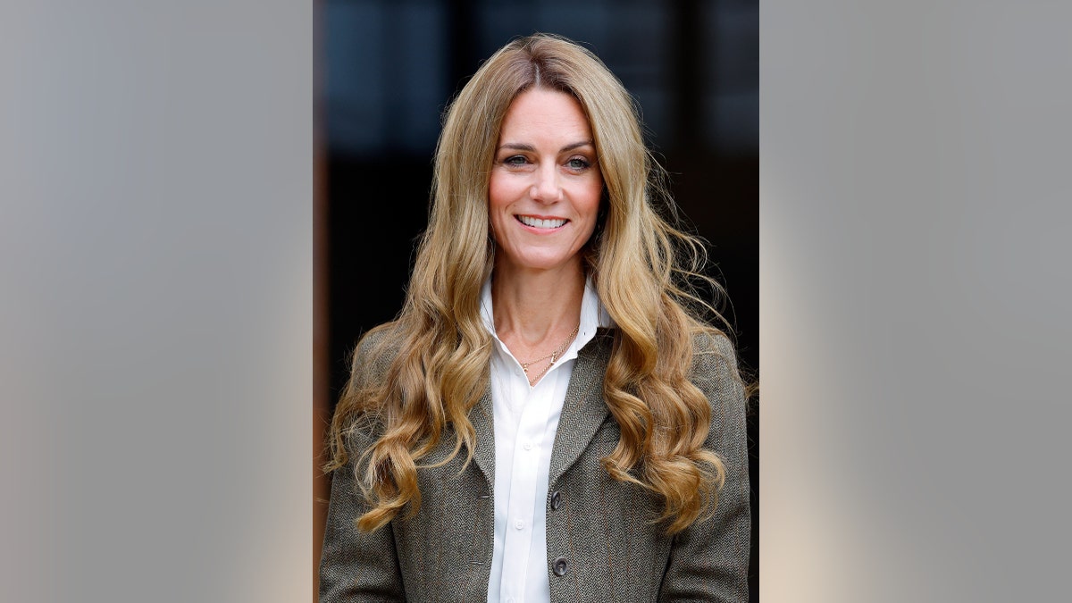 Kate Middleton with long blonde tresses at a royal event.