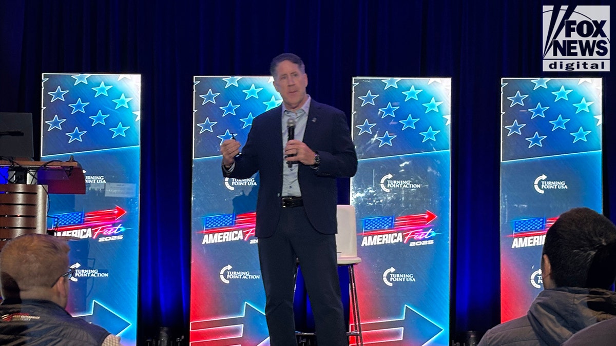 University president speaks on stage at AmFest 2025