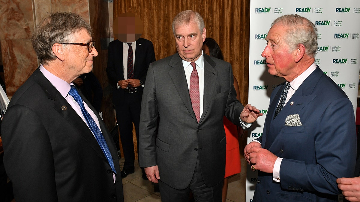 King Charles, Prince Andrew, and Bill Gates talk in a group at the Malaria Summit in Northumberland Avenue on April 18, 2018, in London, England