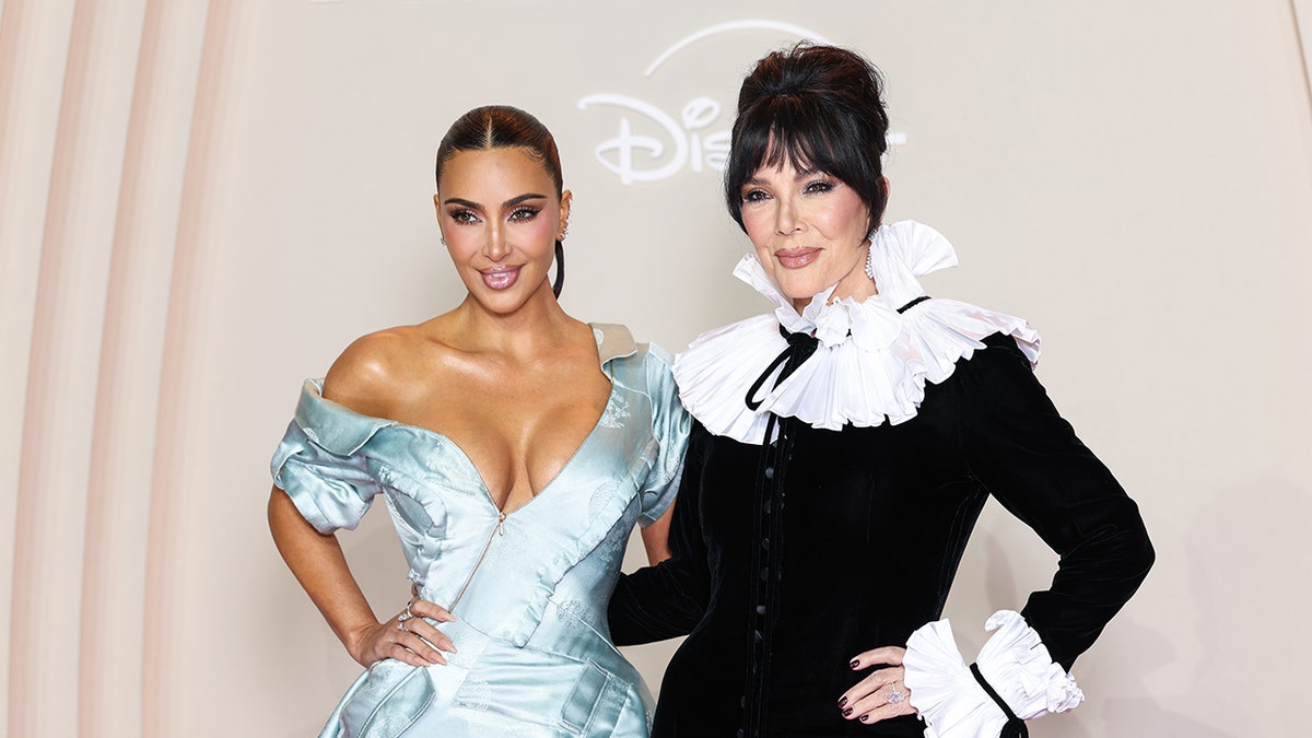 Kim Kardashian and Kris Jenner in glamorous gowns on the red carpet.