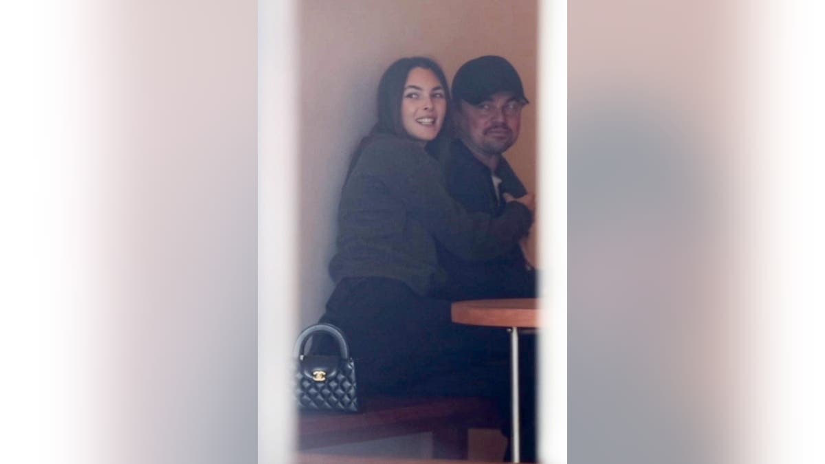 Leonardo DiCaprio and girlfriend Vittoria Ceretti share affectionate moments while dining and shopping on Melrose Place, Los Angeles.