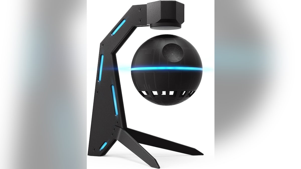 A futuristic speaker that floats and spins in the air. 