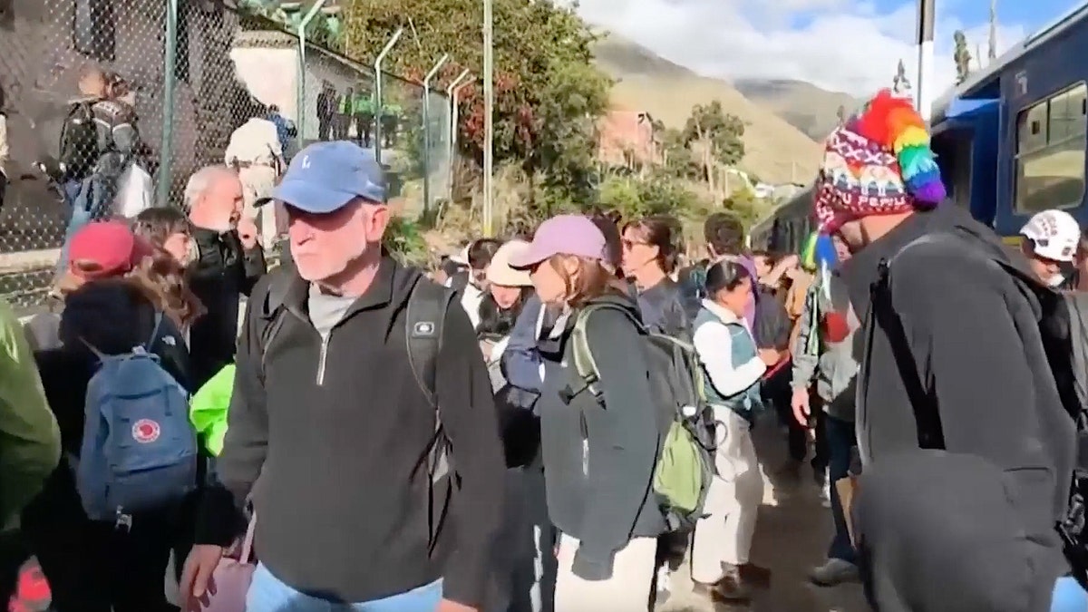 Passengers exit train after collision in Peru