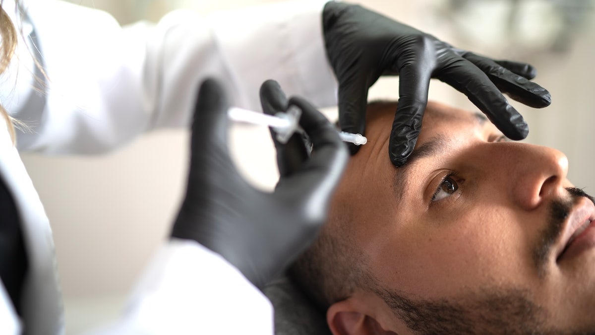 Man being injected with filler