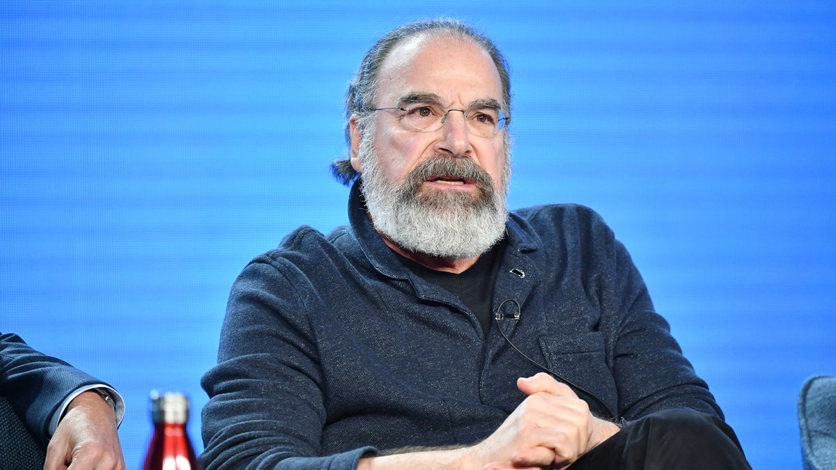 Mandy Patinkin sits in a chair during the Winter TCA Press Tour