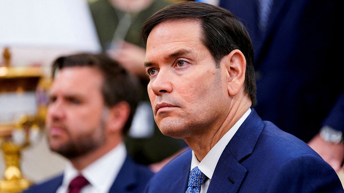 U.S. Secretary of State Marco Rubio listening in meeting