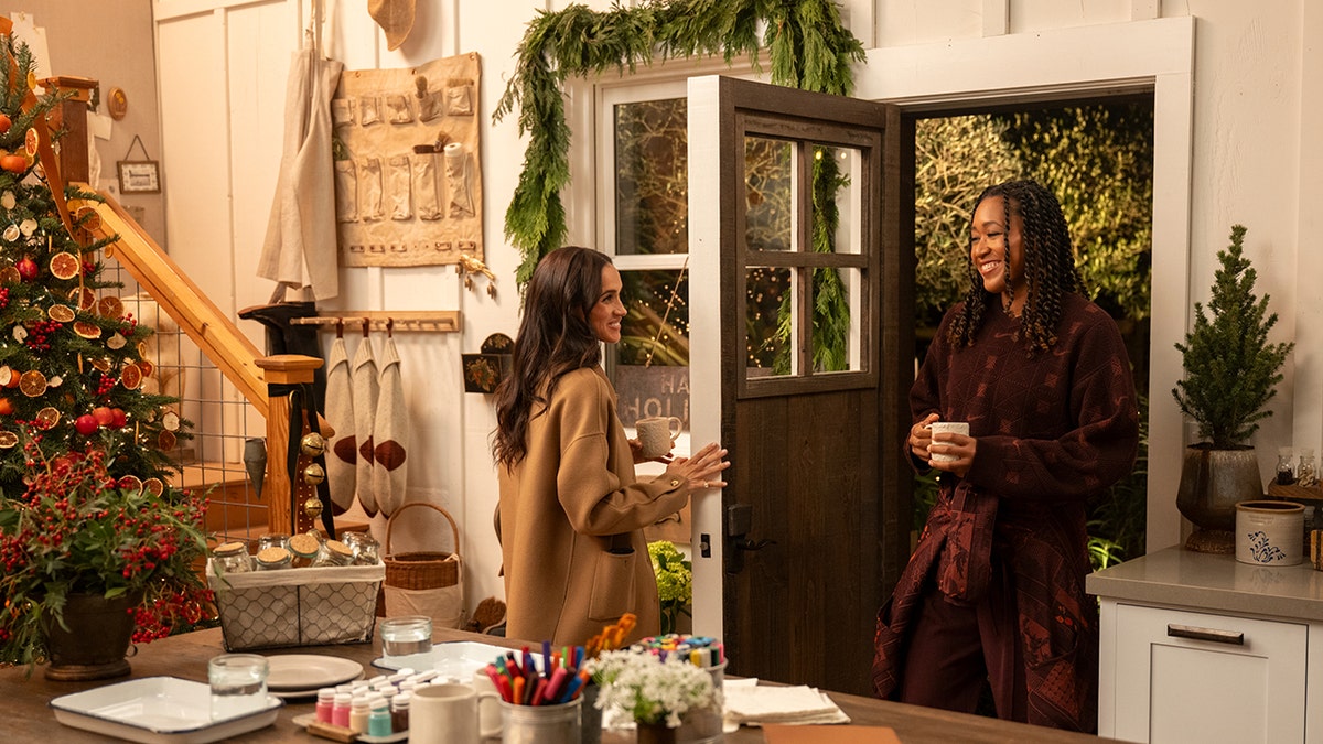 Meghan Markle greeting Naomi Osaka at the door.