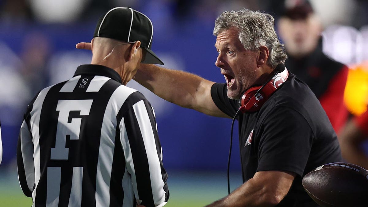 Kyle Whittingham yells at a ref