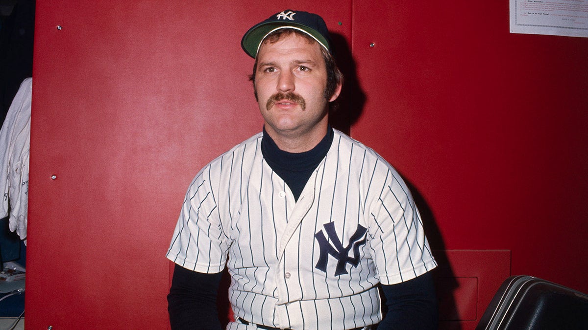 Thurman Munson takes a photo
