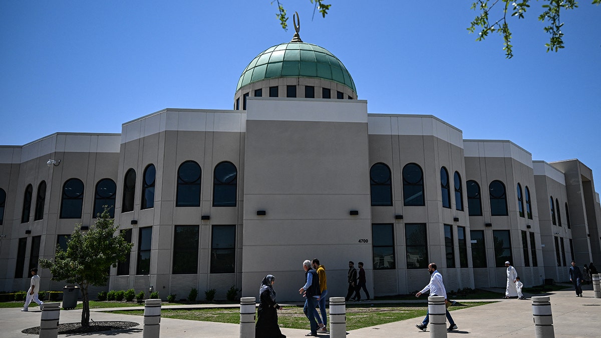 Muslims walk outside mosque in Texas
