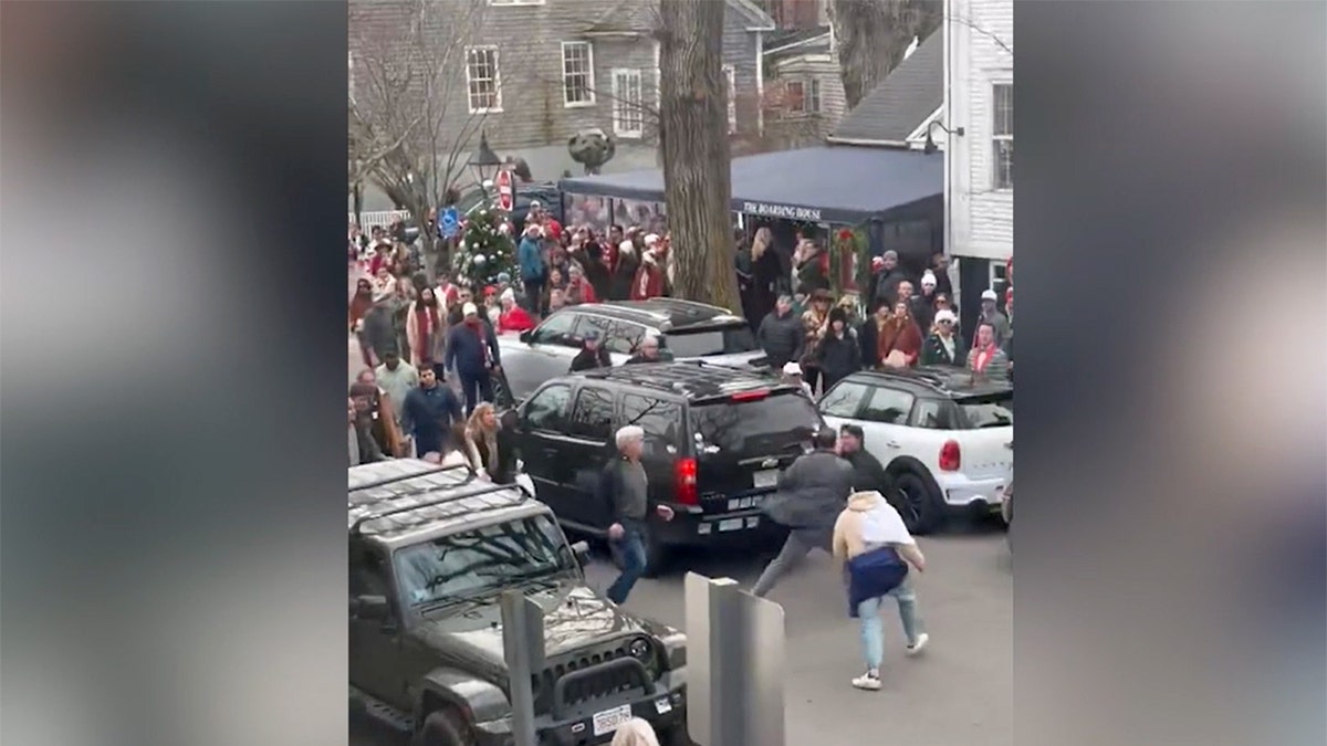 A crowd of people watching a fight