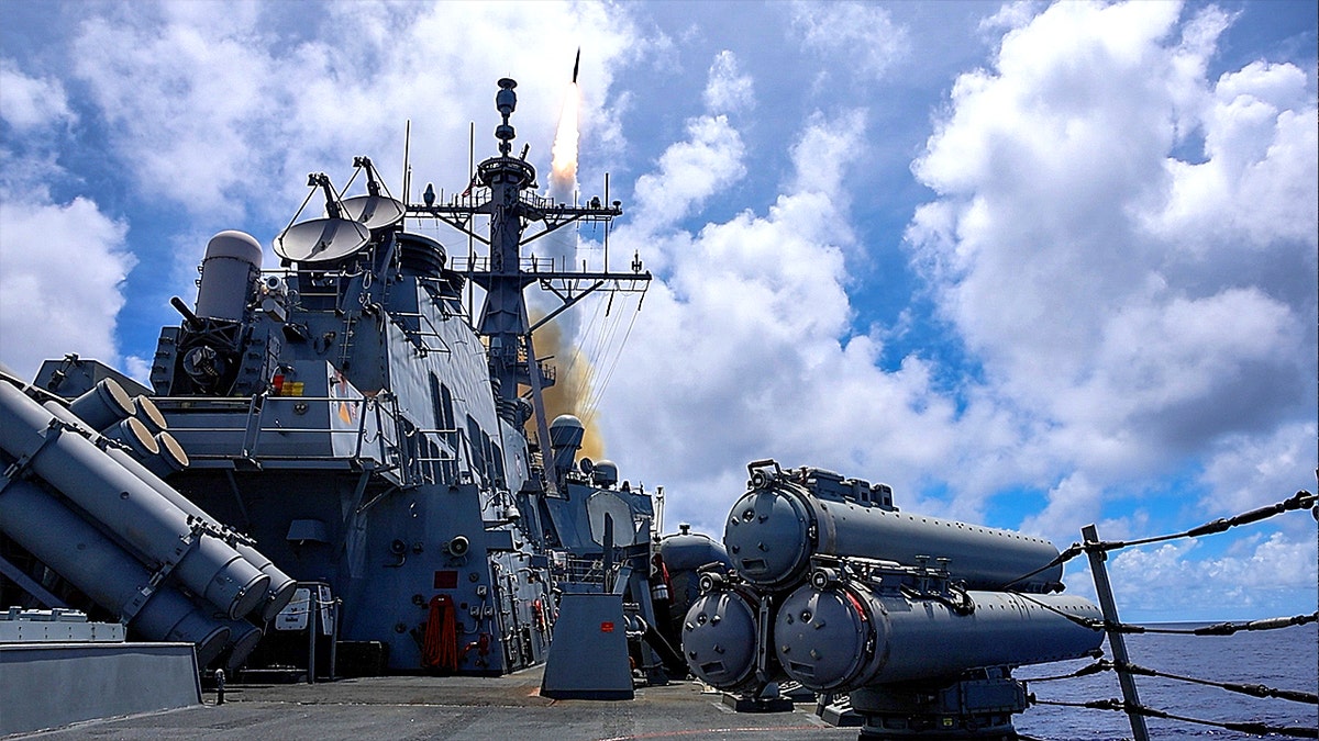 USS Higgins conducts a live fire exercise in Philippine Sea.