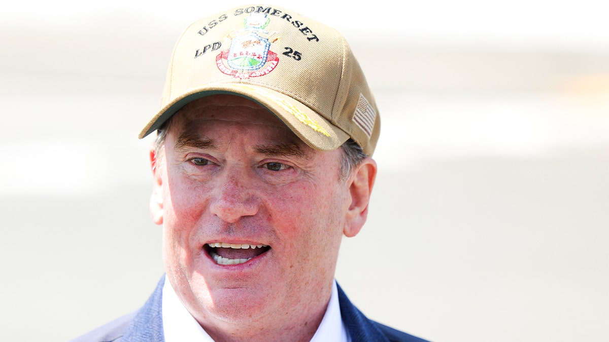 Navy Secretary John Phelan speaks to the media on the USS Somerset on Tuesday, Aug. 26, 2025 in National City, California.