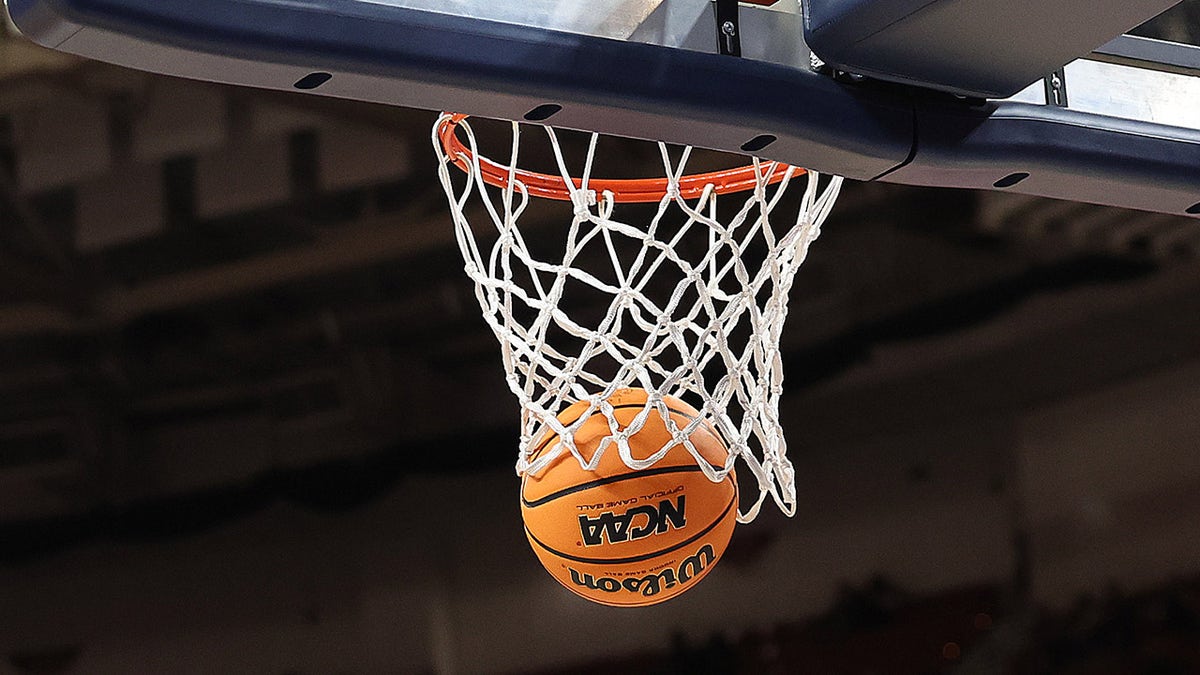 NCAA basketball with ball in net during SEC women's tournament