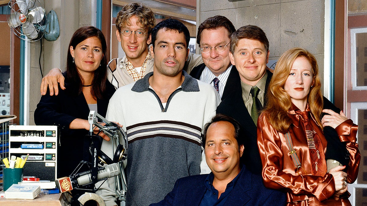 the cast of "NewsRadio" on set