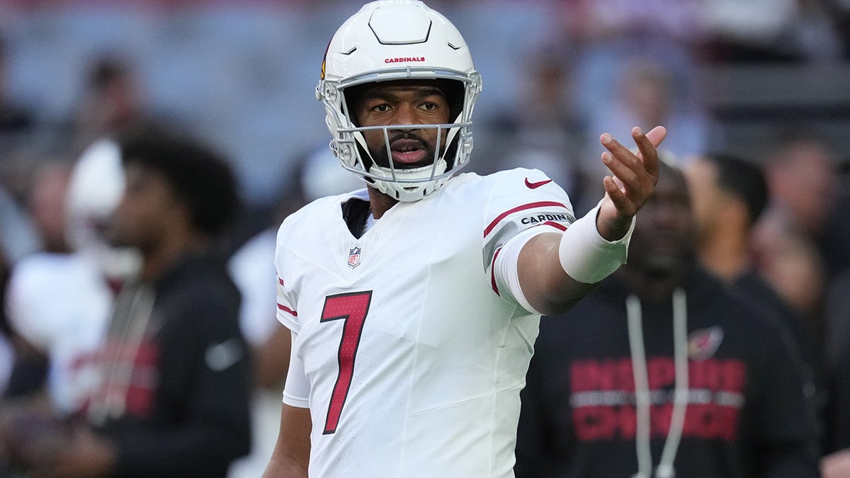 Jacoby Brissett warms up for the game