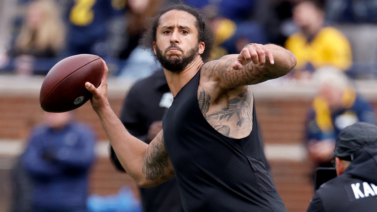 Colin Kaepernick throws a pass