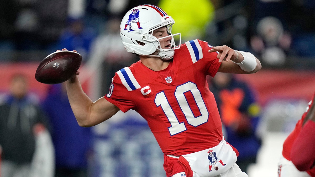 Drake Maye drops back to pass