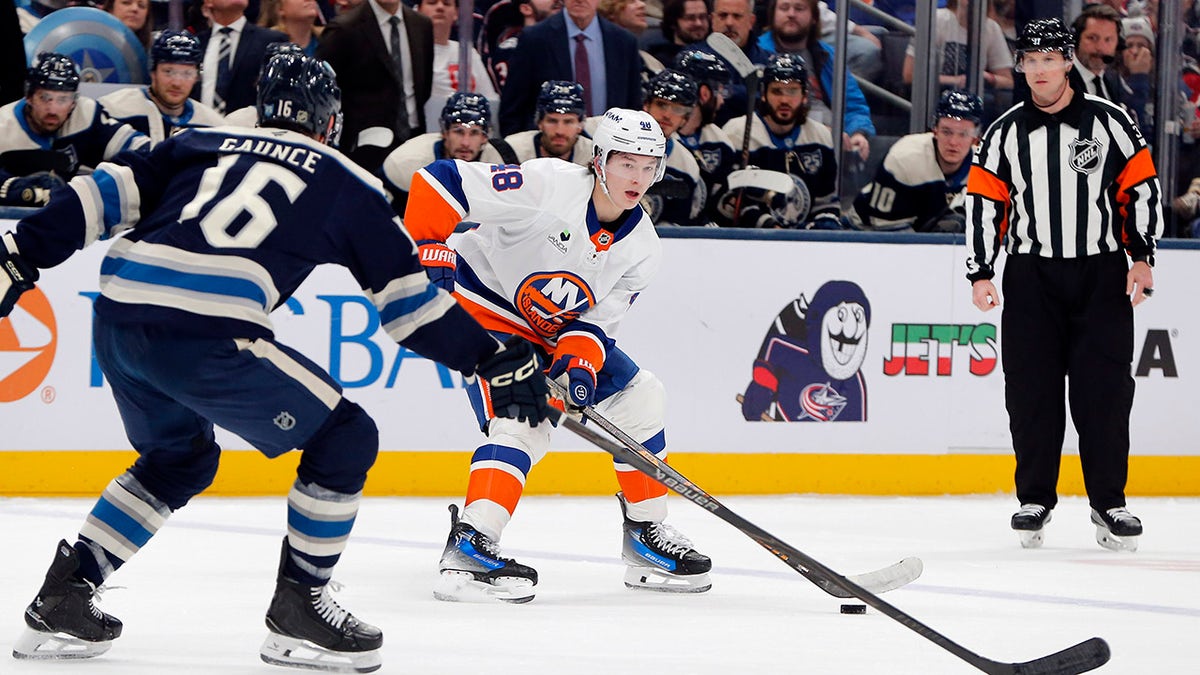 Matthew Schaefer has the puck