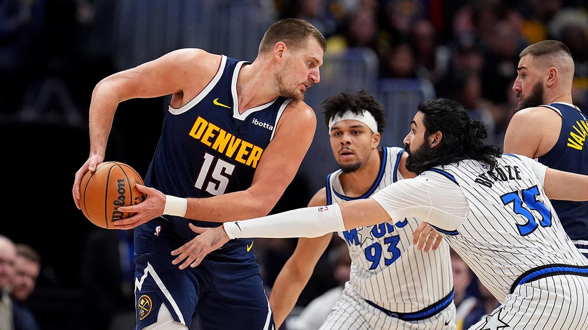 Nikola Jokic looks to pass