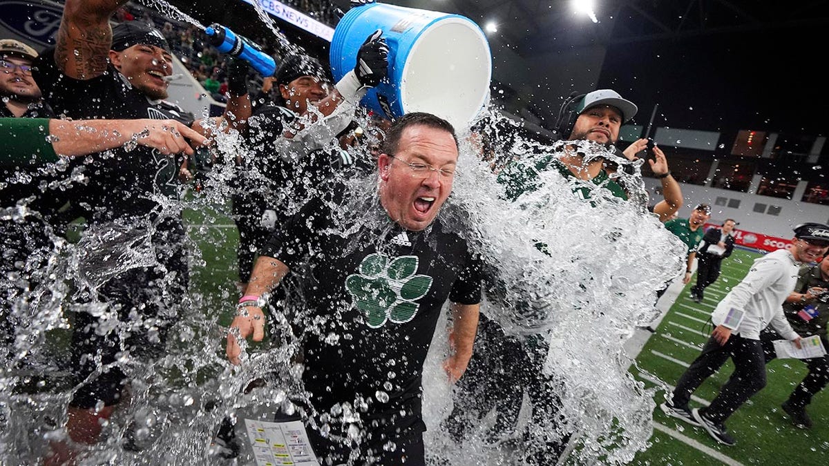 John Hauser gets drenched