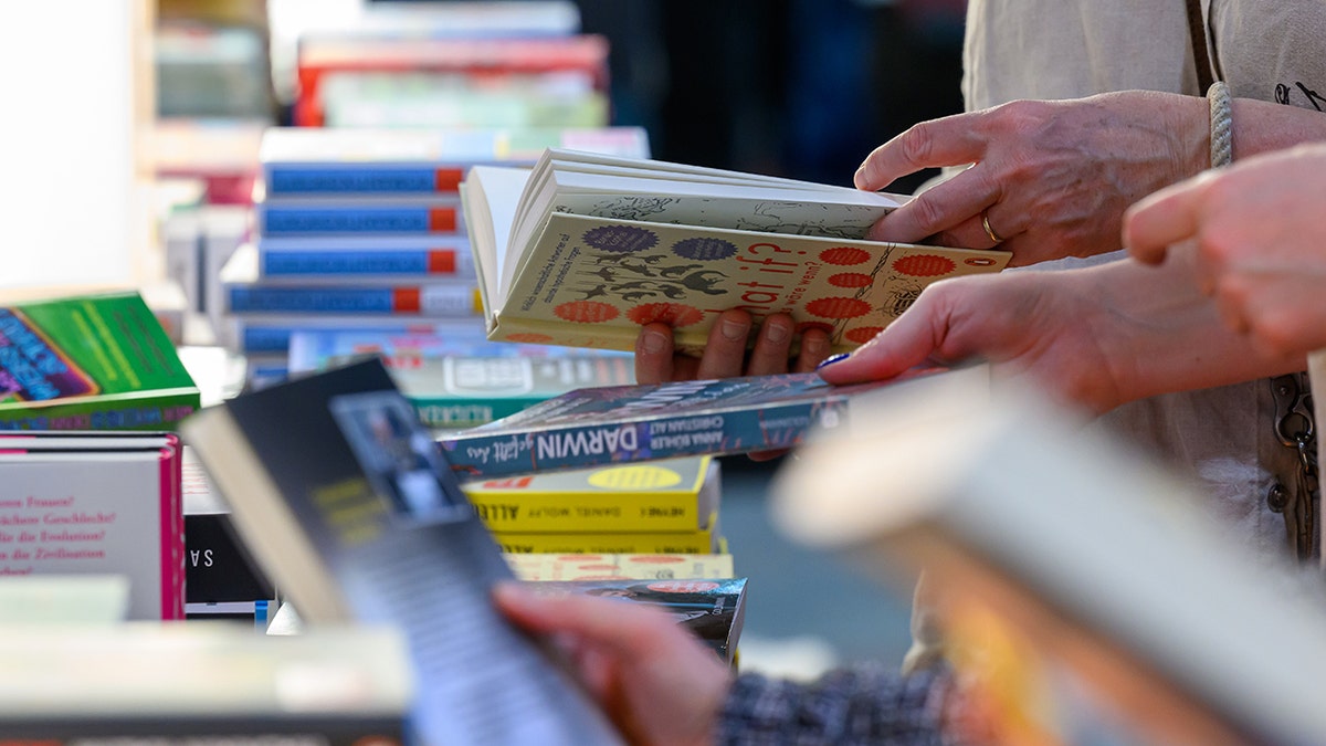 Readers skimming Penguin Random House books