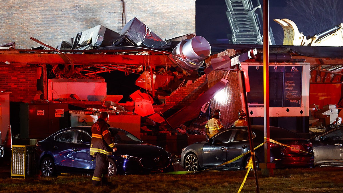 First responders work at the scene of an explosion in Bristol, Pa., Tuesday, Dec. 23, 2025. (Monica Herndon/The Philadelphia Inquirer via AP)