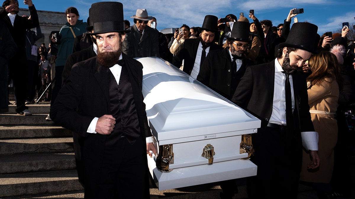 Funeral for the USA Penny with President Abraham Lincoln impersonators in attendance