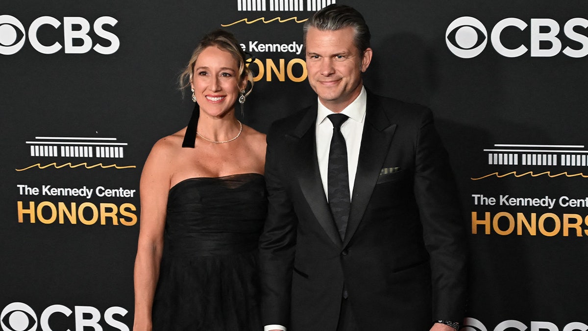 Pete Hegseth and wife Jennifer Rauchet Hegseth matched in black.